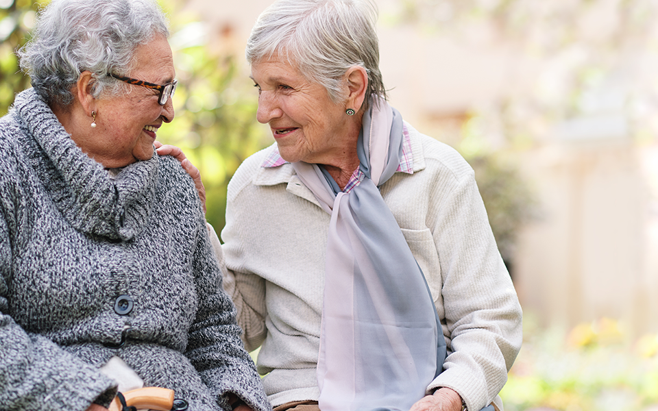 Trust-Estate-Admin-960x600 – Capital Bank Two older women sitting closely together are looking at each other smiling