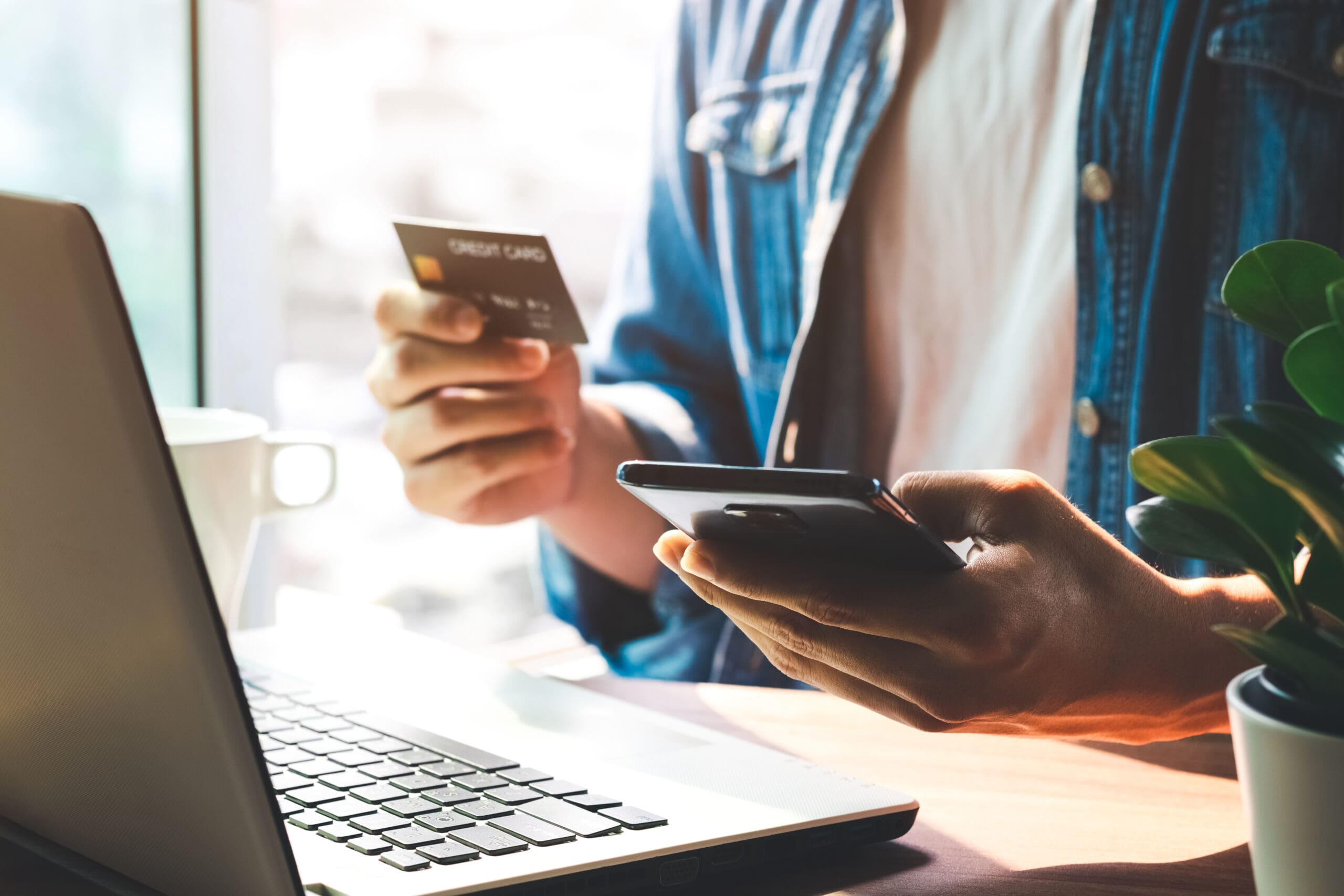 Men use their credit cards through mobile internet banking apps
