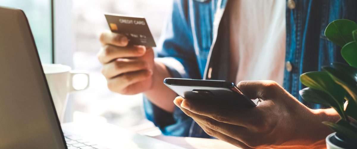 Men use their credit cards through mobile internet banking apps