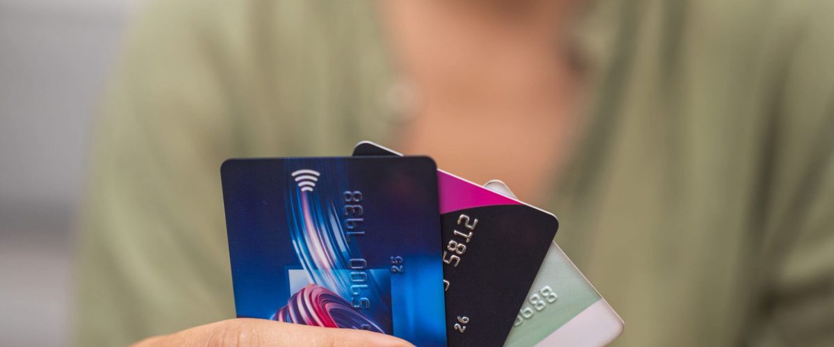 Woman holding a stack of credit cards